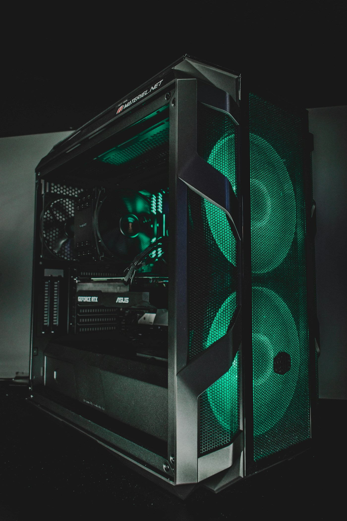 Black PC tower with visible internal cooling and graphics card